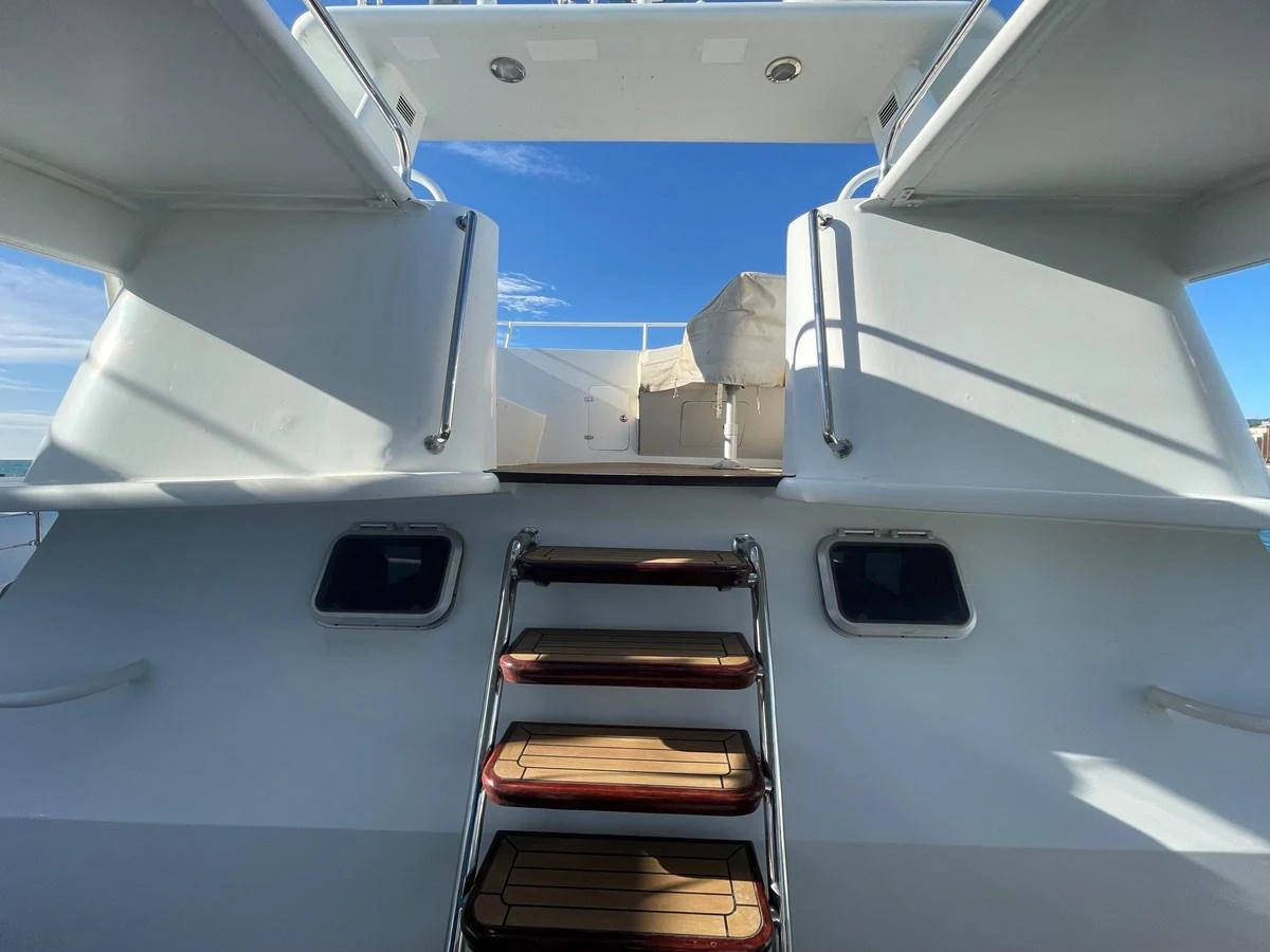 The yacht's aft deck features a sleek design with steps leading up to the upper deck. aboard ATB MAROC  CUSTOM MOTOR YACHT Yacht for Sale
