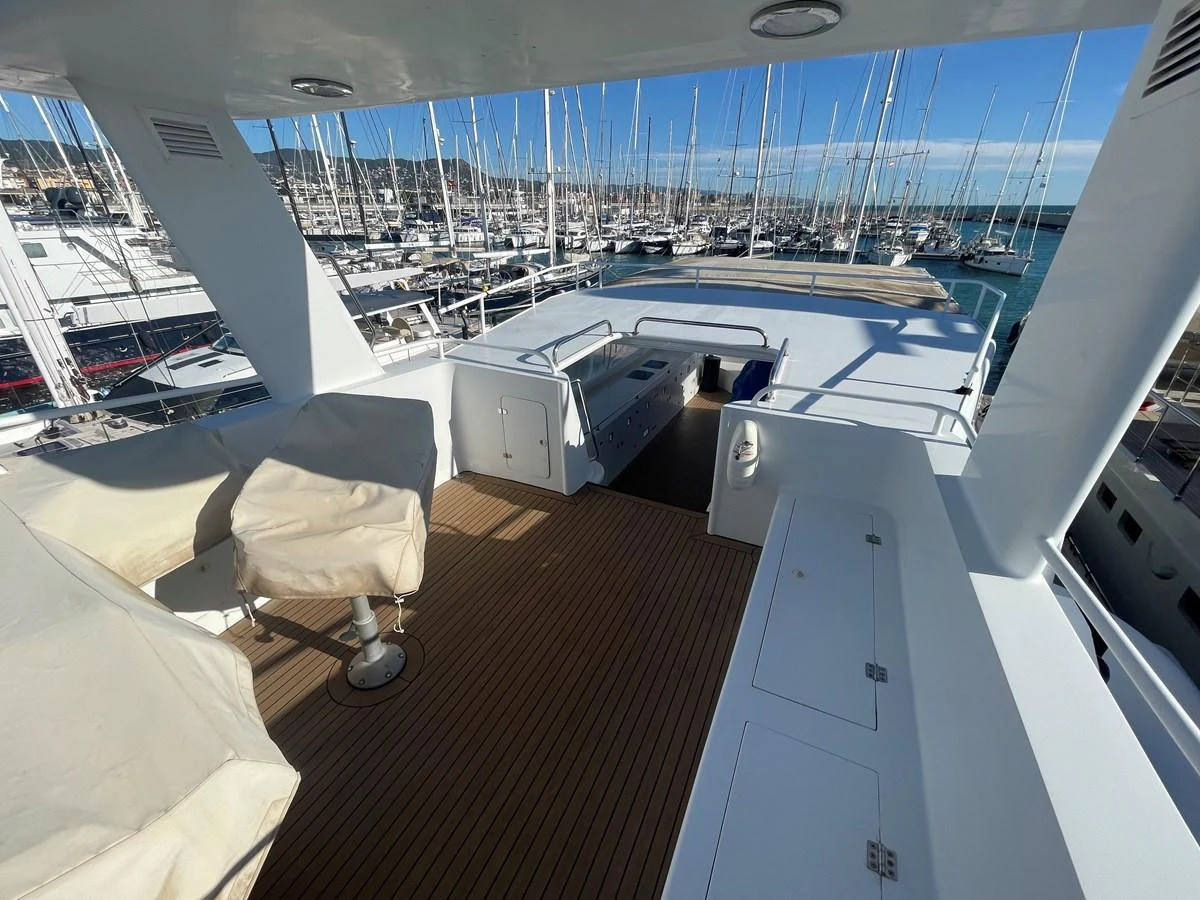The flybridge offers a spacious and open area with ample seating and stunning views of the marina. aboard ATB MAROC  CUSTOM MOTOR YACHT Yacht for Sale