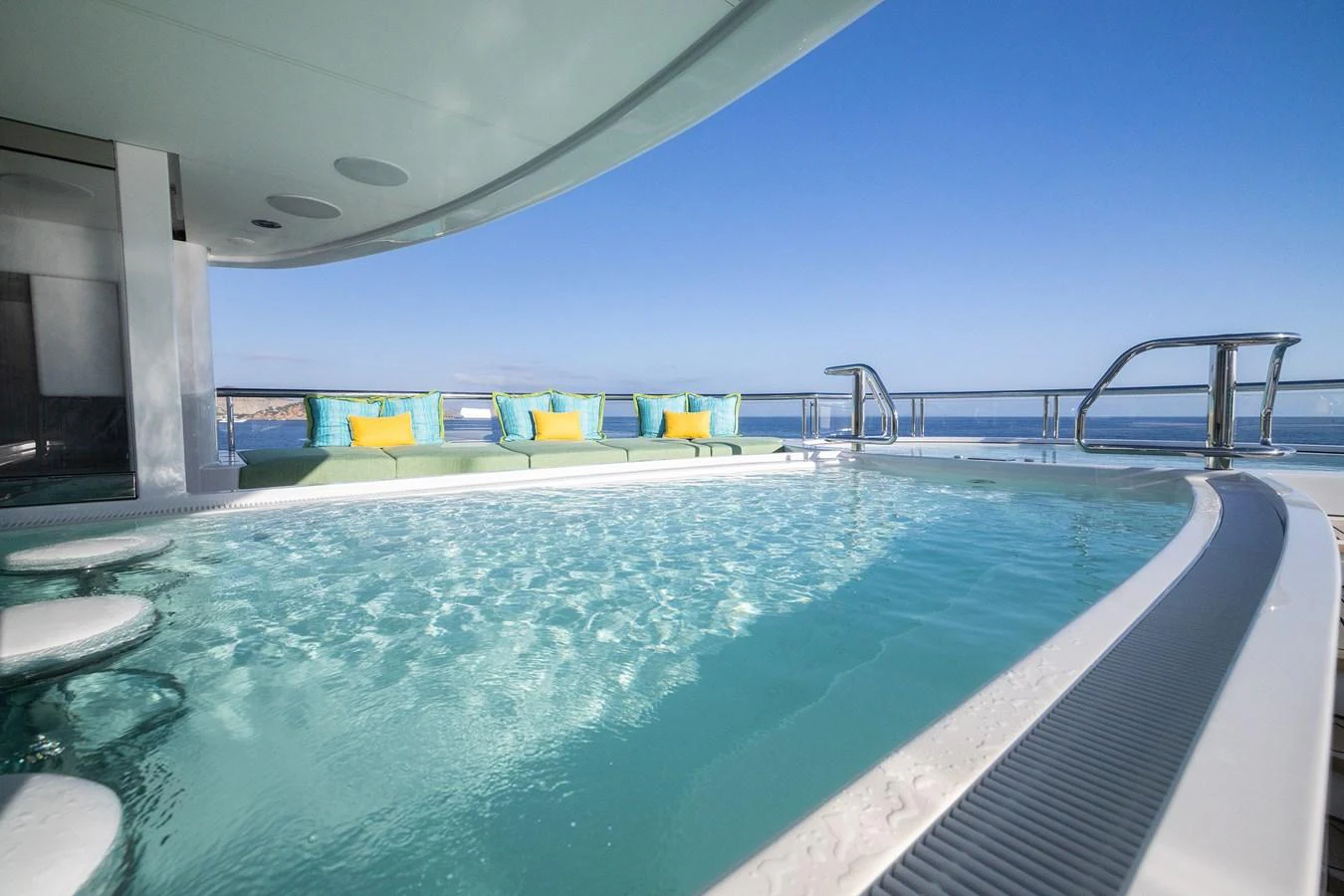 a pool with a bridge in the background aboard ROCINANTE Yacht for Sale