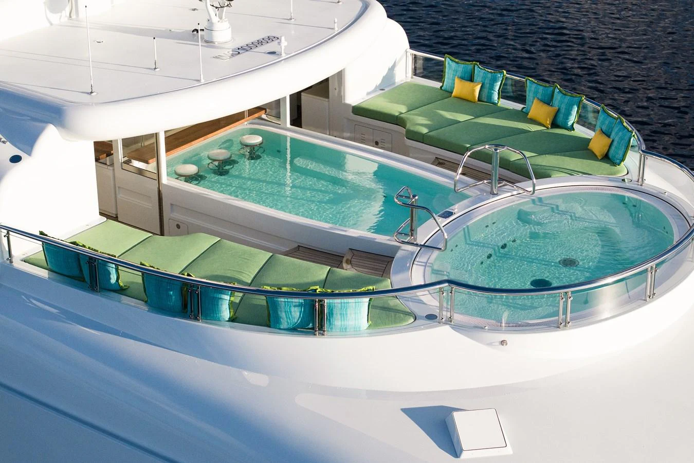 a swimming pool with green and blue plastic containers on it aboard ROCINANTE Yacht for Sale