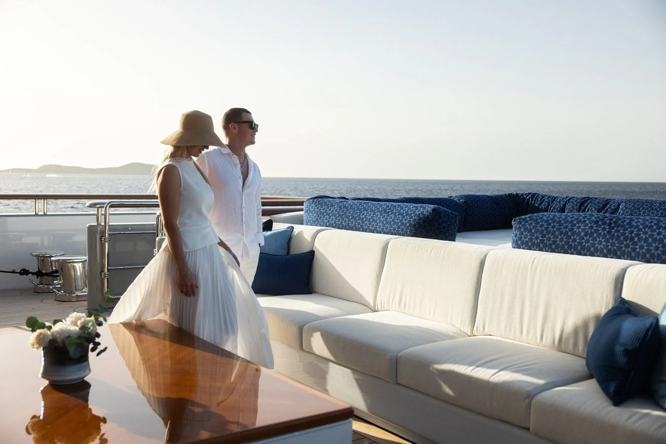 a man and woman posing for a picture aboard ROCINANTE Yacht for Sale