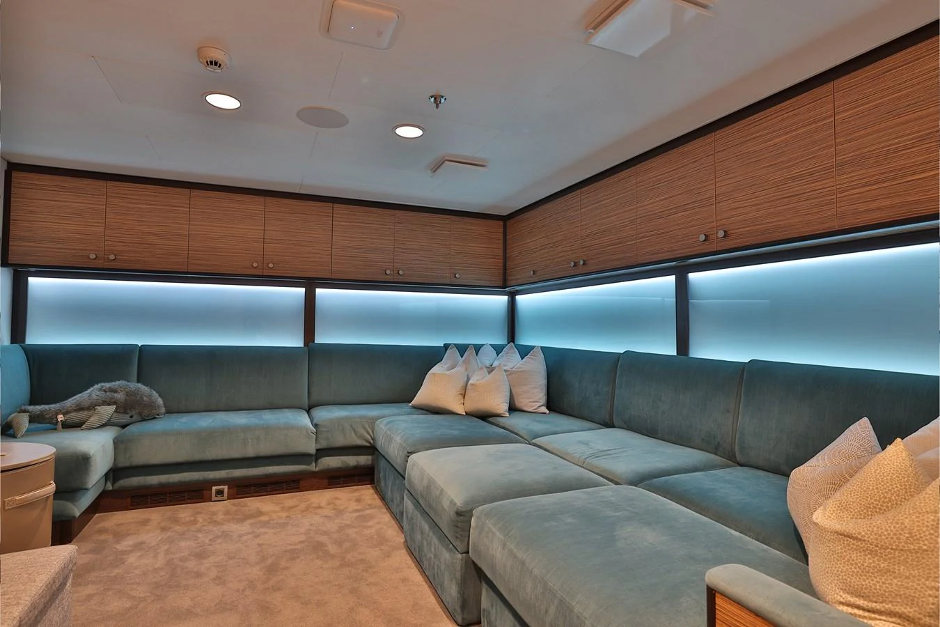 a room with a couch and a television aboard ROCINANTE Yacht for Sale