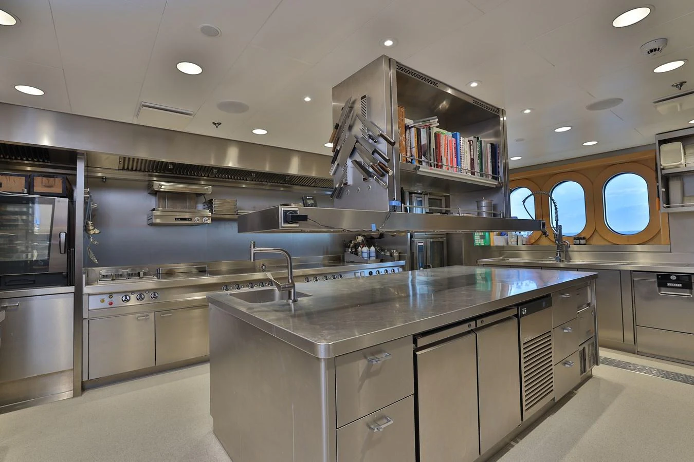 a kitchen with a large island aboard ROCINANTE Yacht for Sale