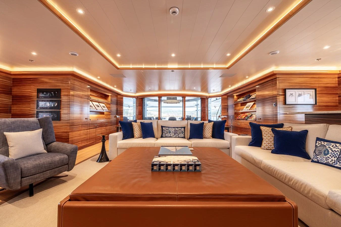 a room with a couch and a table aboard ROCINANTE Yacht for Sale
