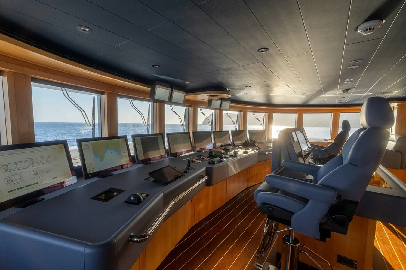 a room with computers and monitors aboard ROCINANTE Yacht for Sale