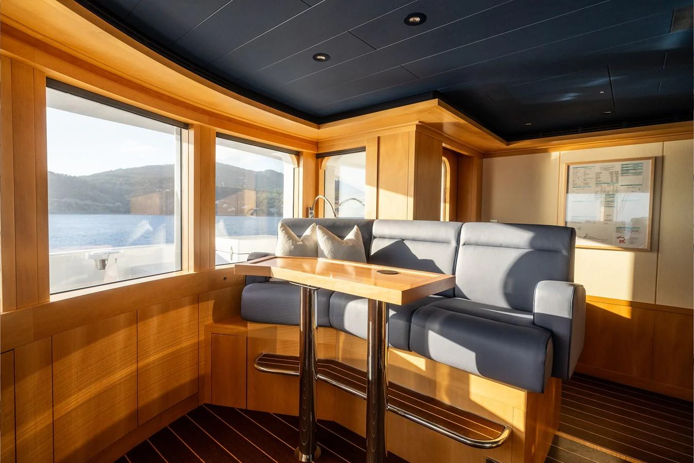 a room with a table and chairs aboard ROCINANTE Yacht for Sale