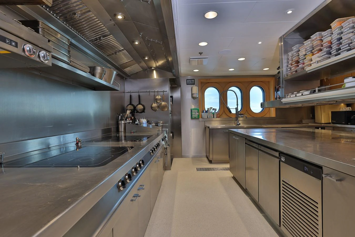 a large kitchen with stainless steel appliances aboard ROCINANTE Yacht for Sale