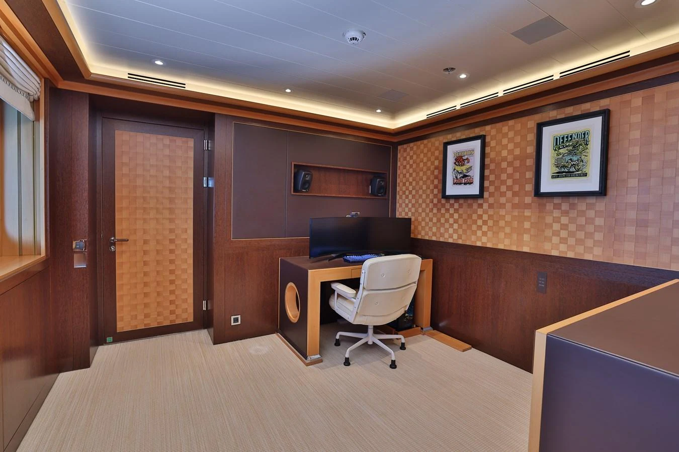 a room with a desk and a chair aboard ROCINANTE Yacht for Sale