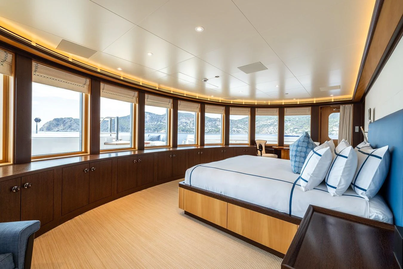 a large room with a couch and a window aboard ROCINANTE Yacht for Sale