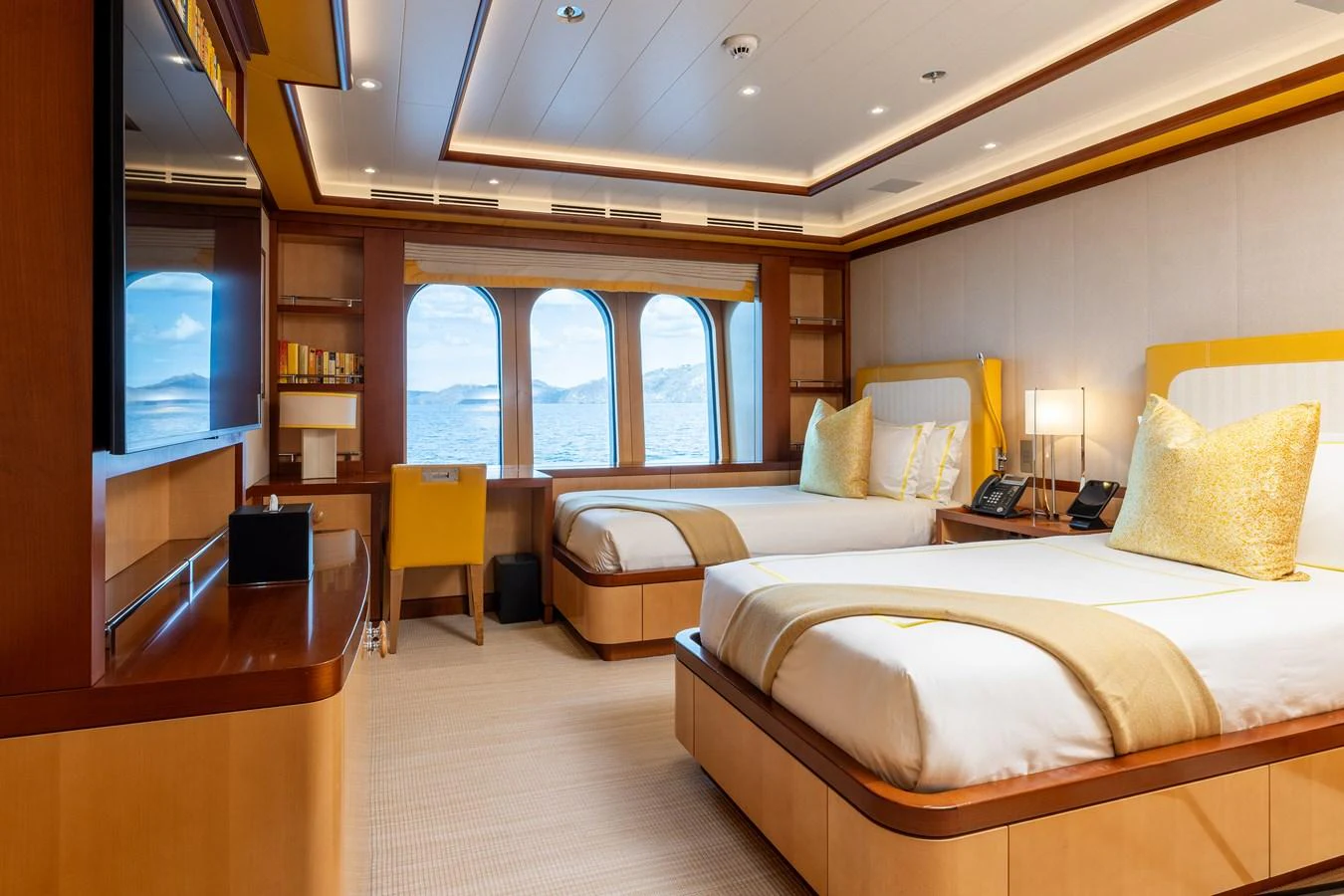 a room with a bed and a tv aboard ROCINANTE Yacht for Sale