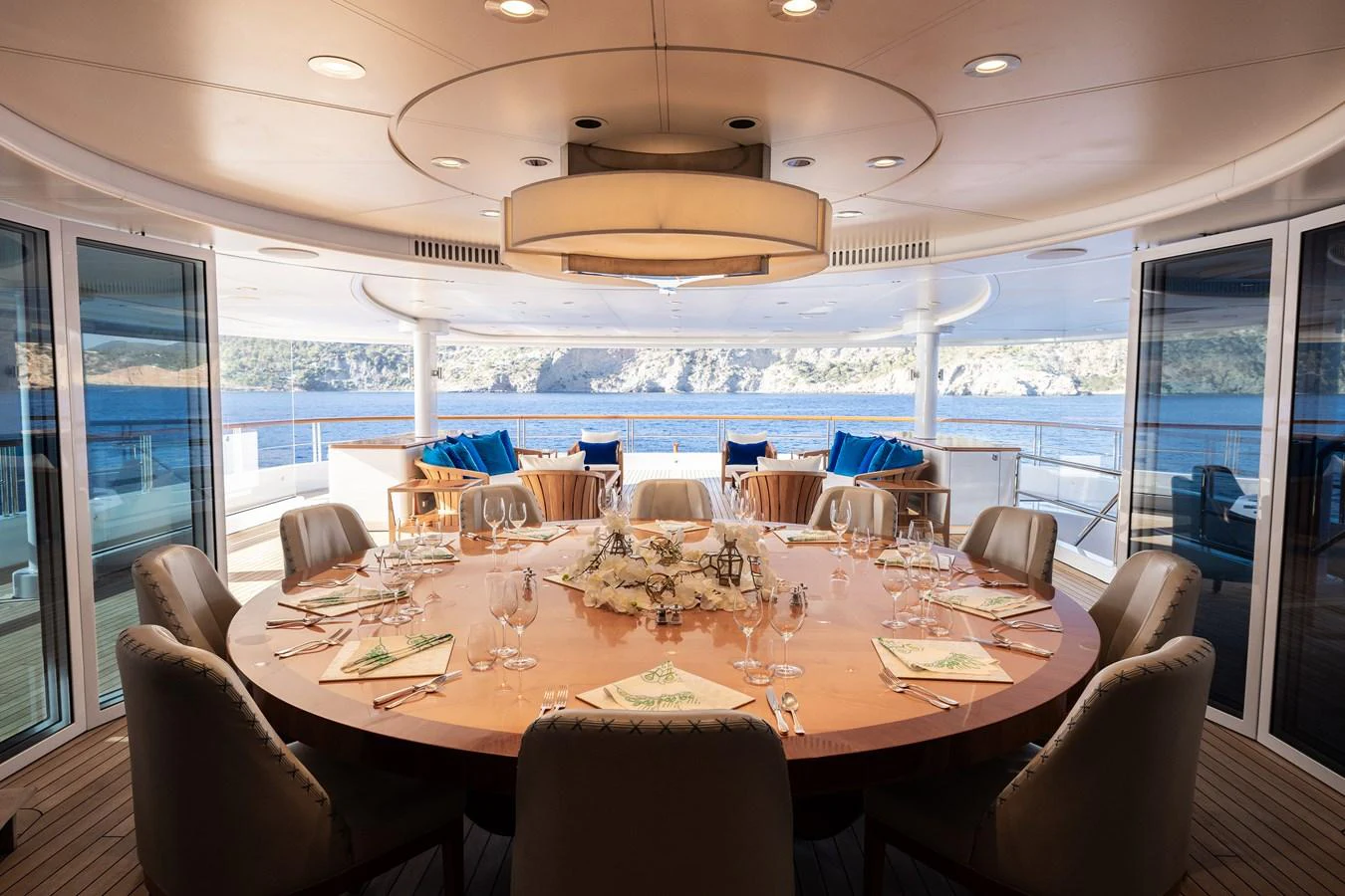 a dining room with a large window aboard ROCINANTE Yacht for Sale