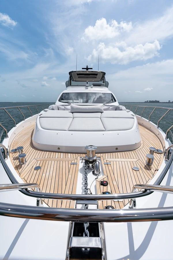 The yacht's foredeck features luxurious sun pads and a sleek design, perfect for relaxation and enjoying the sea views. aboard EUPHORIA Yacht for Sale