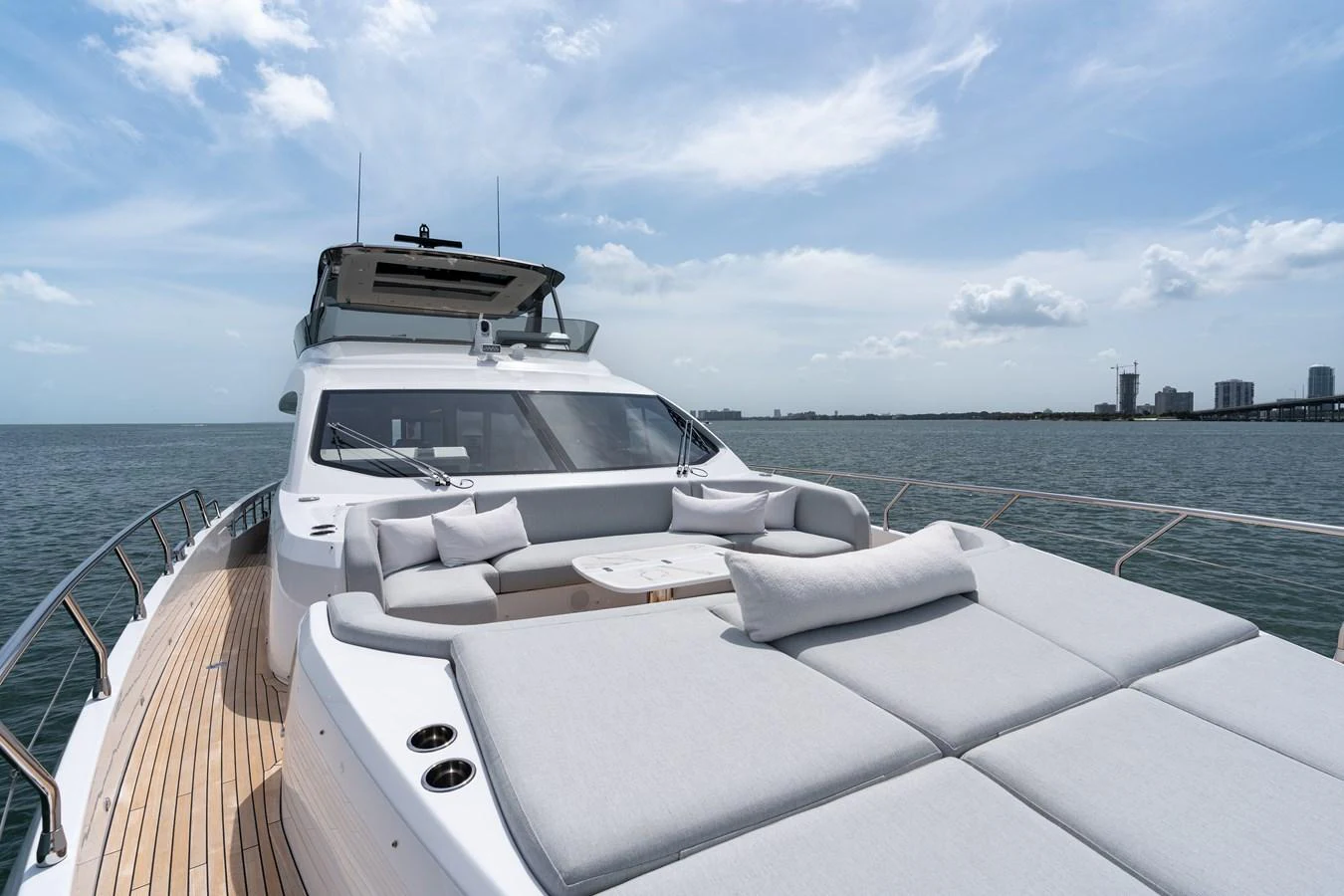 The foredeck of this yacht features luxurious sun pads and a comfortable seating area, perfect for relaxation. aboard EUPHORIA Yacht for Sale