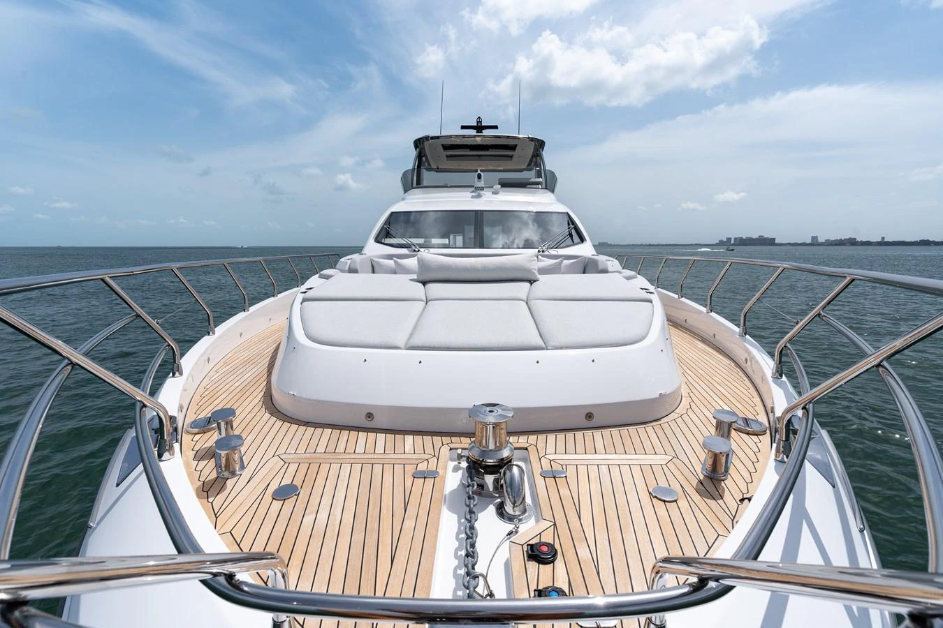 The foredeck offers a spacious sunbathing area with plush cushions and a sleek design. aboard EUPHORIA Yacht for Sale