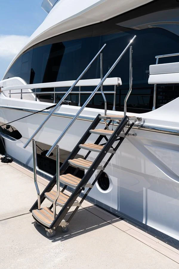 A sleek set of stairs leads up to the yacht's deck, showcasing its modern design and craftsmanship. aboard EUPHORIA Yacht for Sale