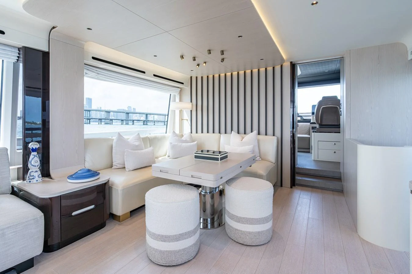 The salon features a modern and spacious seating area with elegant decor and ample natural light. aboard EUPHORIA Yacht for Sale