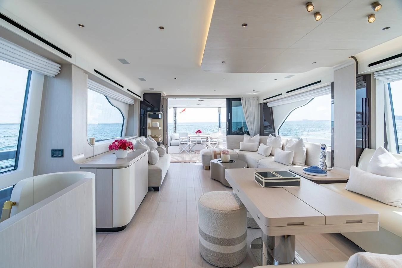 The spacious salon offers a luxurious and comfortable setting with panoramic ocean views. aboard EUPHORIA Yacht for Sale