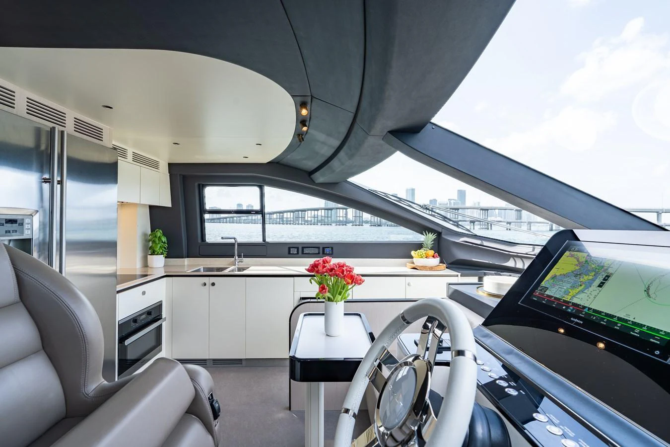 The helm station offers a sleek and modern design with panoramic views and state-of-the-art navigation equipment. aboard EUPHORIA Yacht for Sale