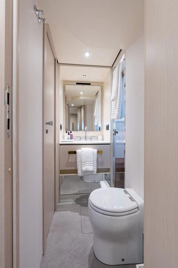 A modern yacht bathroom with sleek fixtures and a clean design. aboard EUPHORIA Yacht for Sale