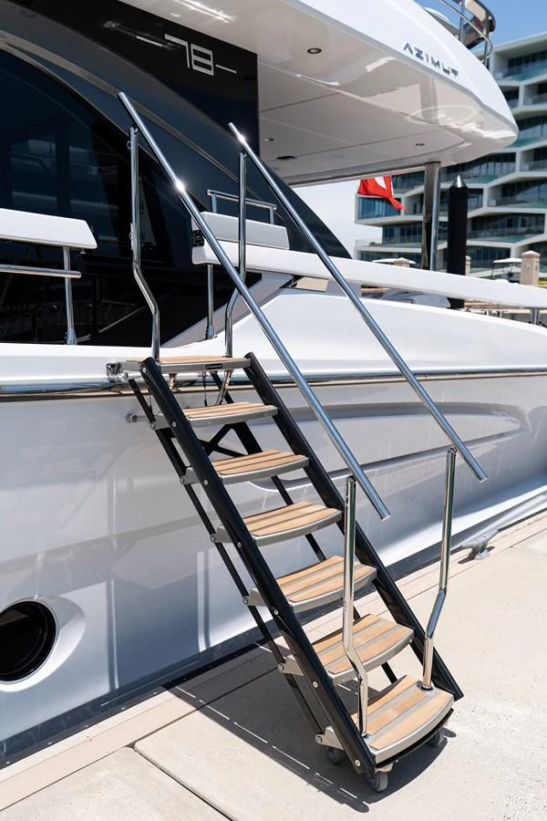 The image showcases the boarding stairs of a yacht, highlighting the sleek design and quality materials. aboard EUPHORIA Yacht for Sale