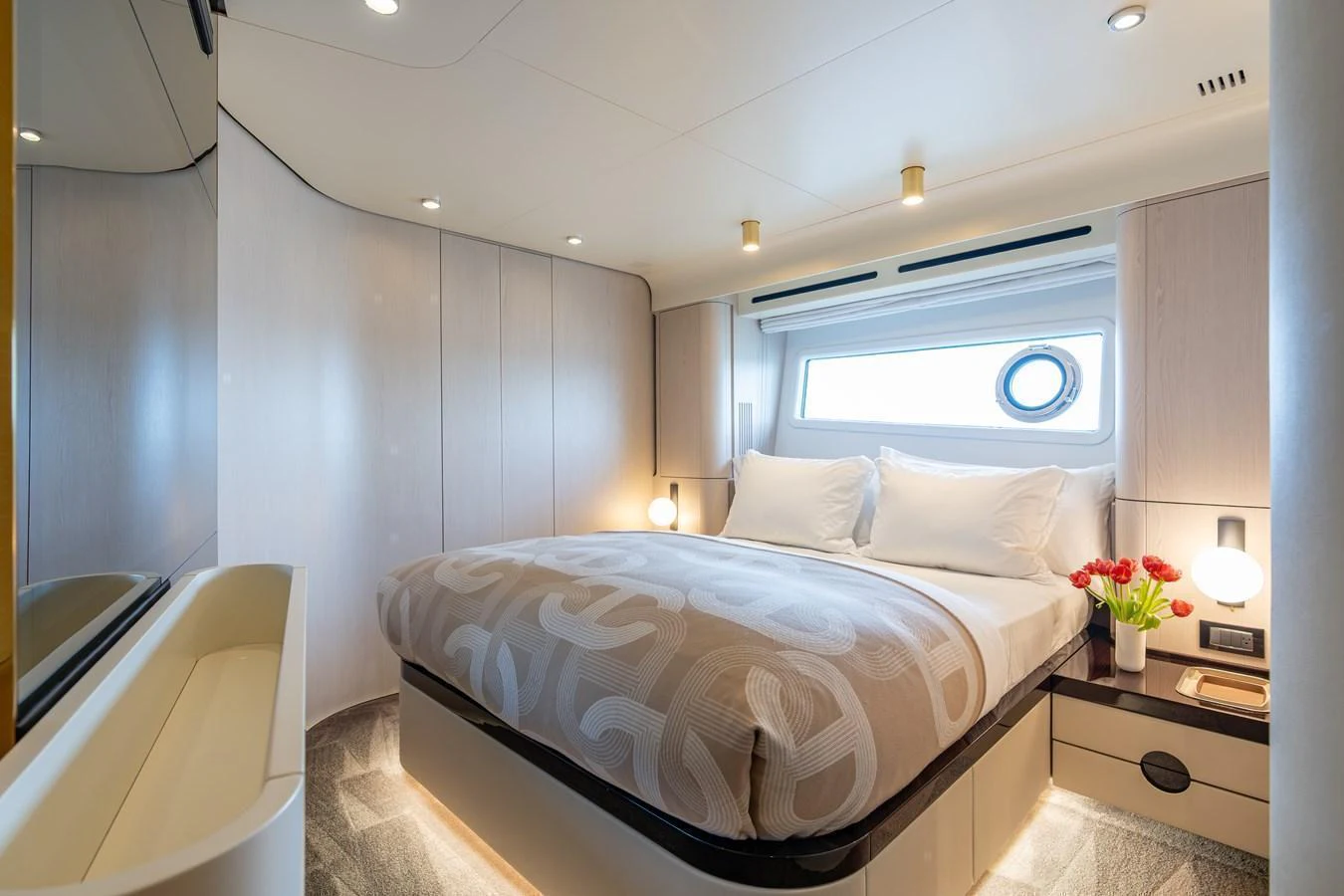 A cozy and well-lit stateroom featuring a comfortable bed and modern decor. aboard EUPHORIA Yacht for Sale