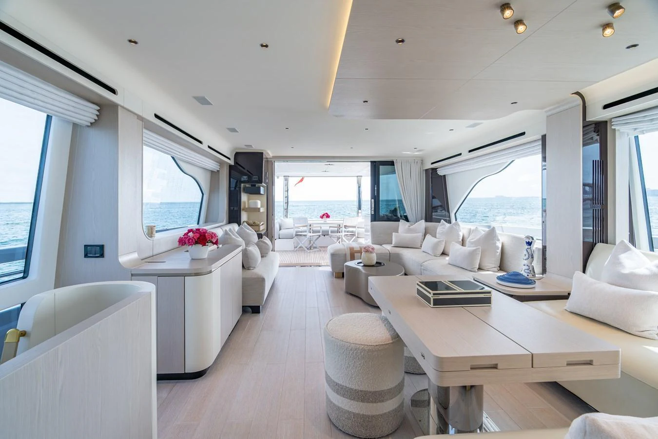 The spacious salon offers a luxurious and comfortable setting with panoramic ocean views. aboard EUPHORIA Yacht for Sale