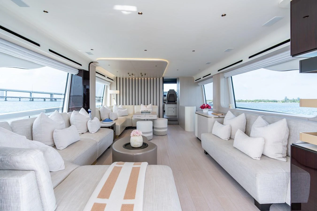The salon features a spacious and elegantly designed seating area with large windows offering panoramic views. aboard EUPHORIA Yacht for Sale