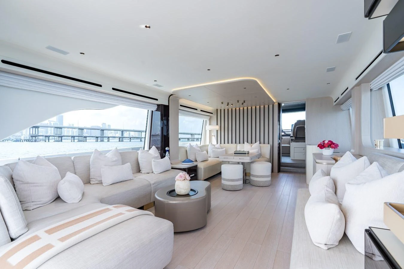 The spacious salon features modern furnishings and panoramic windows for a luxurious and comfortable experience. aboard EUPHORIA Yacht for Sale