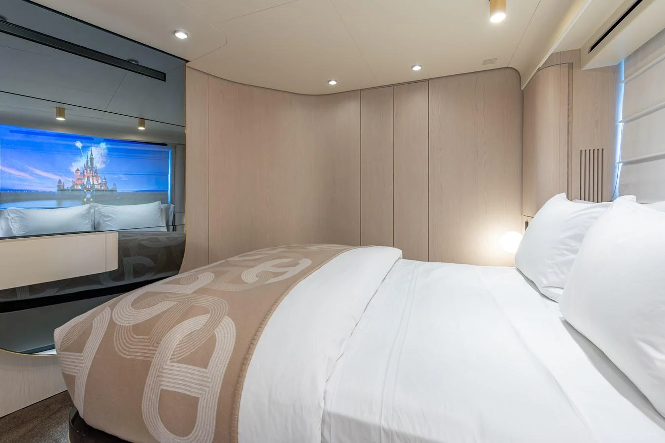 The stateroom features a cozy bed with elegant bedding and soft lighting, creating a serene and inviting atmosphere. aboard EUPHORIA Yacht for Sale