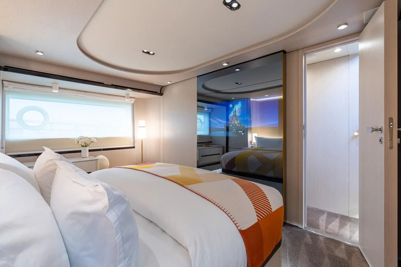 A luxurious stateroom with a cozy bed and modern decor. aboard EUPHORIA Yacht for Sale