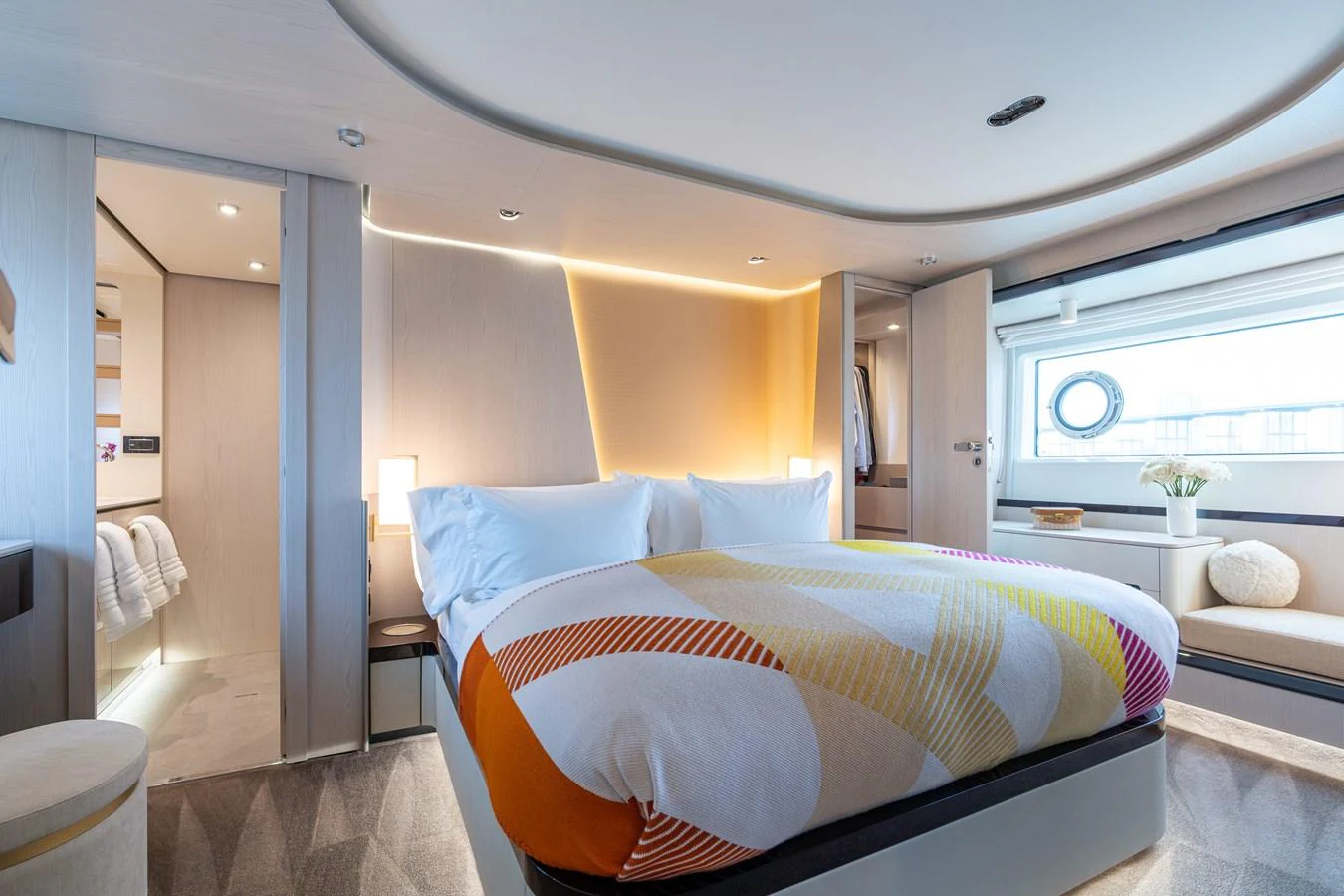 The stateroom features a modern design with a large bed and ample natural light. aboard EUPHORIA Yacht for Sale