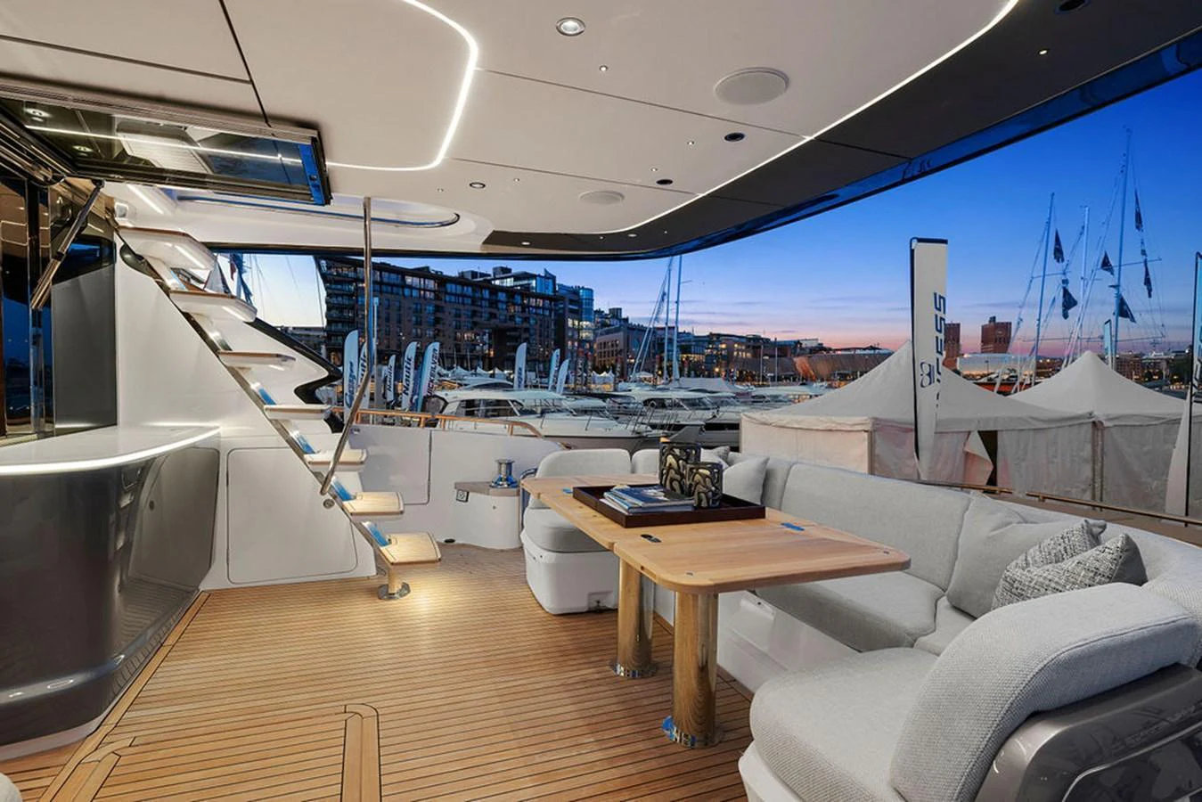 The aft deck features a spacious seating area with a modern design, perfect for evening relaxation. aboard PRINCESS S72 Yacht for Sale