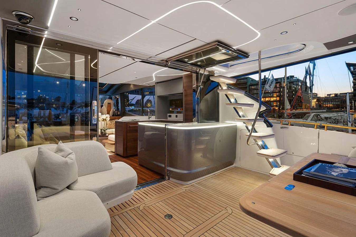 The yacht's salon features modern furnishings and an open layout with a seamless transition to the deck. aboard PRINCESS S72 Yacht for Sale