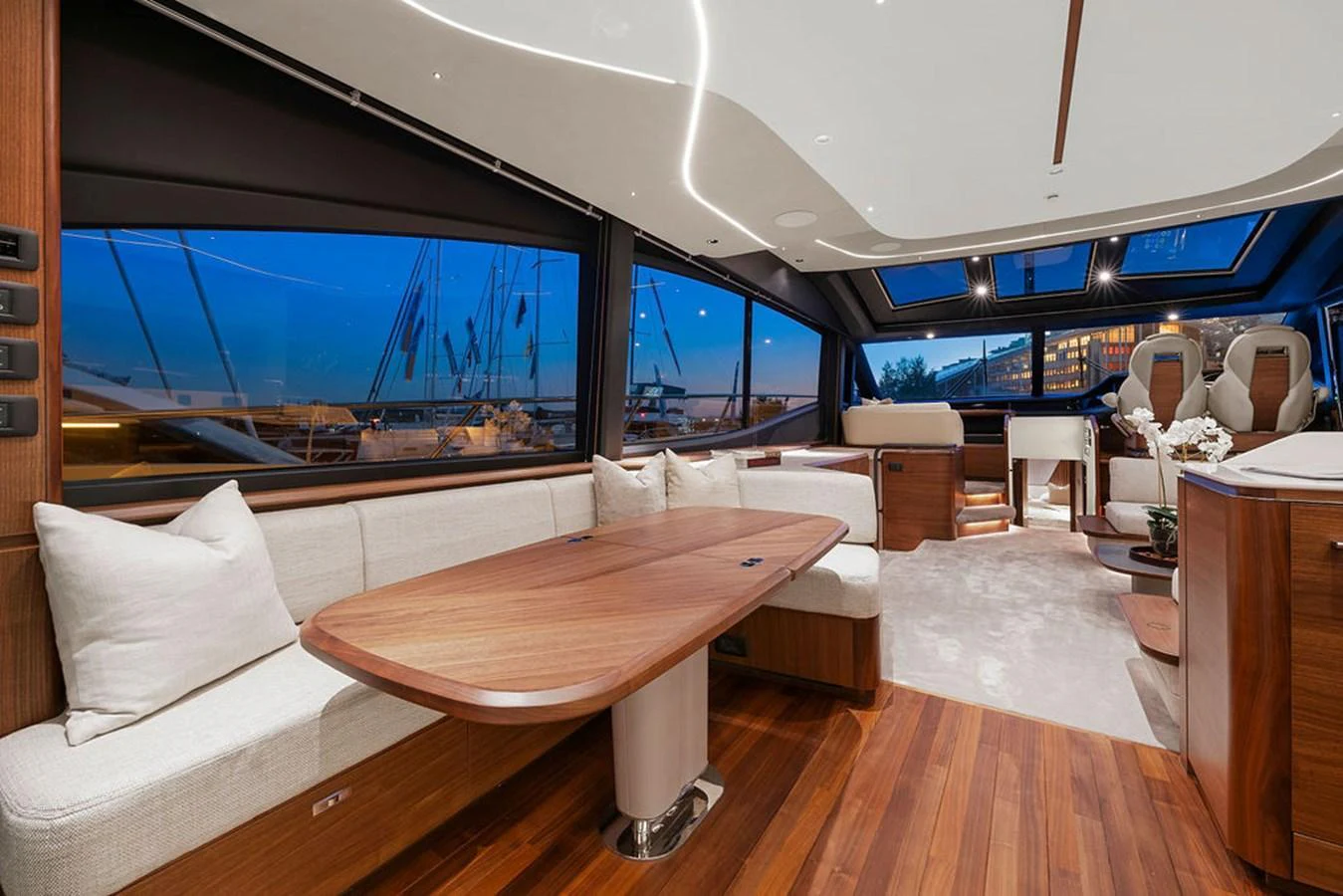 The yacht's salon features elegant wood finishes and large windows offering stunning views. aboard PRINCESS S72 Yacht for Sale