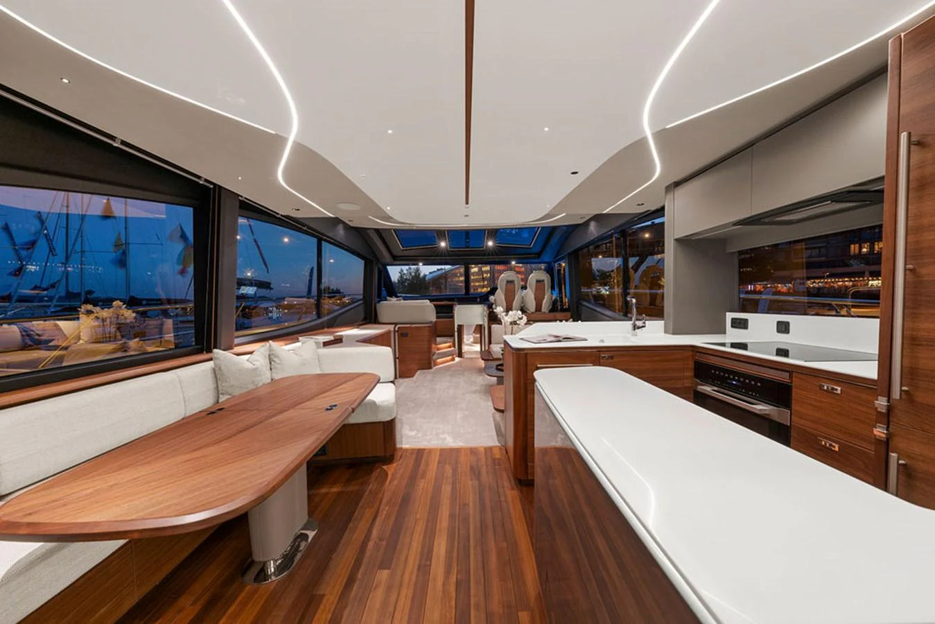 The yacht's salon features a spacious and modern design with ample seating and elegant wooden finishes. aboard PRINCESS S72 Yacht for Sale