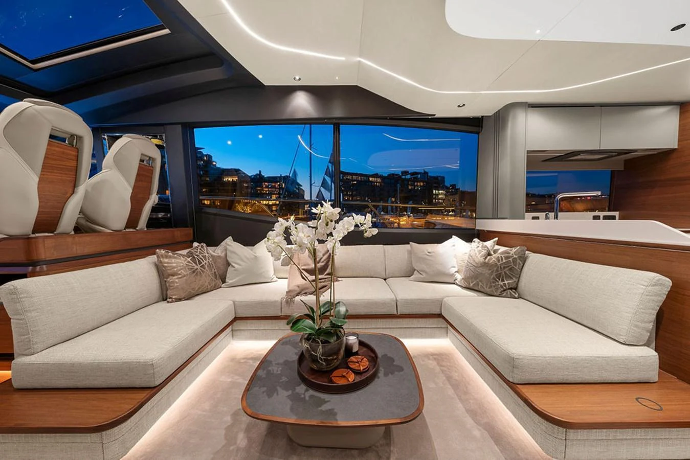 The salon features a spacious seating area with elegant decor and large windows offering stunning views. aboard PRINCESS S72 Yacht for Sale