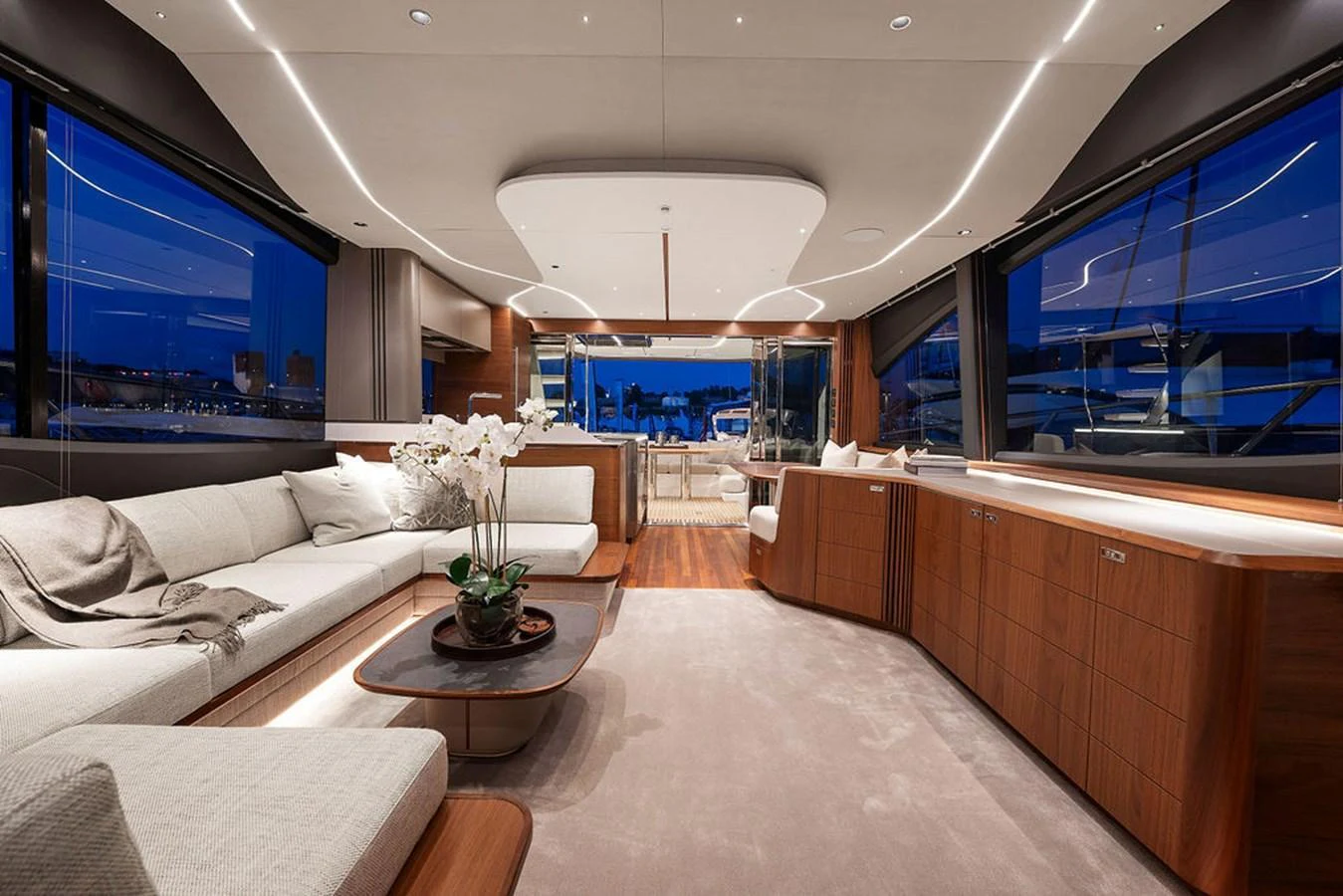 The salon features elegant seating and modern decor with expansive windows offering stunning views. aboard PRINCESS S72 Yacht for Sale