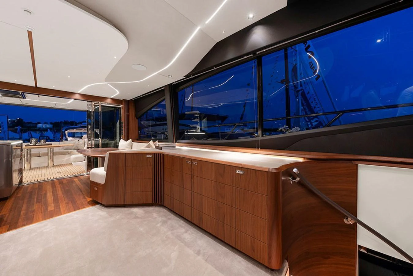 The yacht's salon features elegant wood finishes and expansive windows for a luxurious ambiance. aboard PRINCESS S72 Yacht for Sale