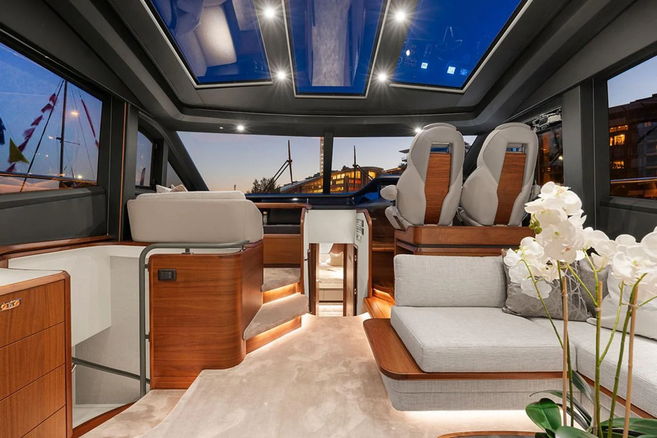 The yacht's salon features luxurious seating, a modern helm, and expansive windows for panoramic views. aboard PRINCESS S72 Yacht for Sale
