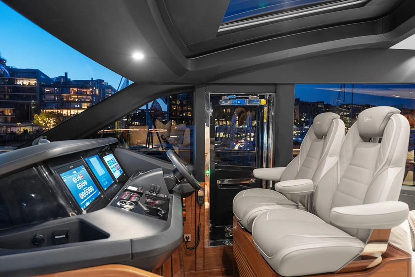 The helm station features modern navigation equipment and luxurious seating, offering a commanding view for the captain. aboard PRINCESS S72 Yacht for Sale