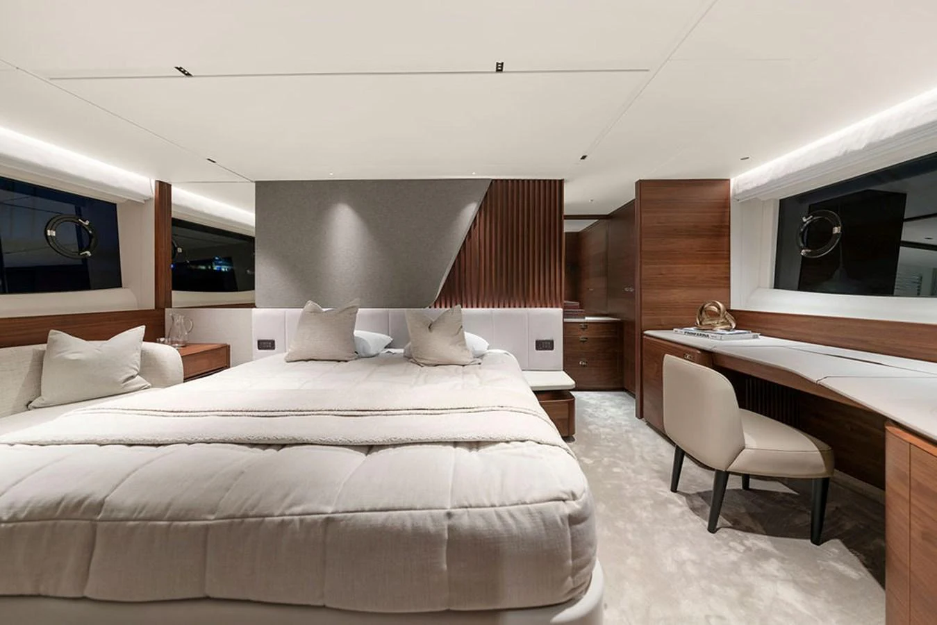 The master stateroom features a luxurious bed, elegant wood finishes, and ample natural light. aboard PRINCESS S72 Yacht for Sale