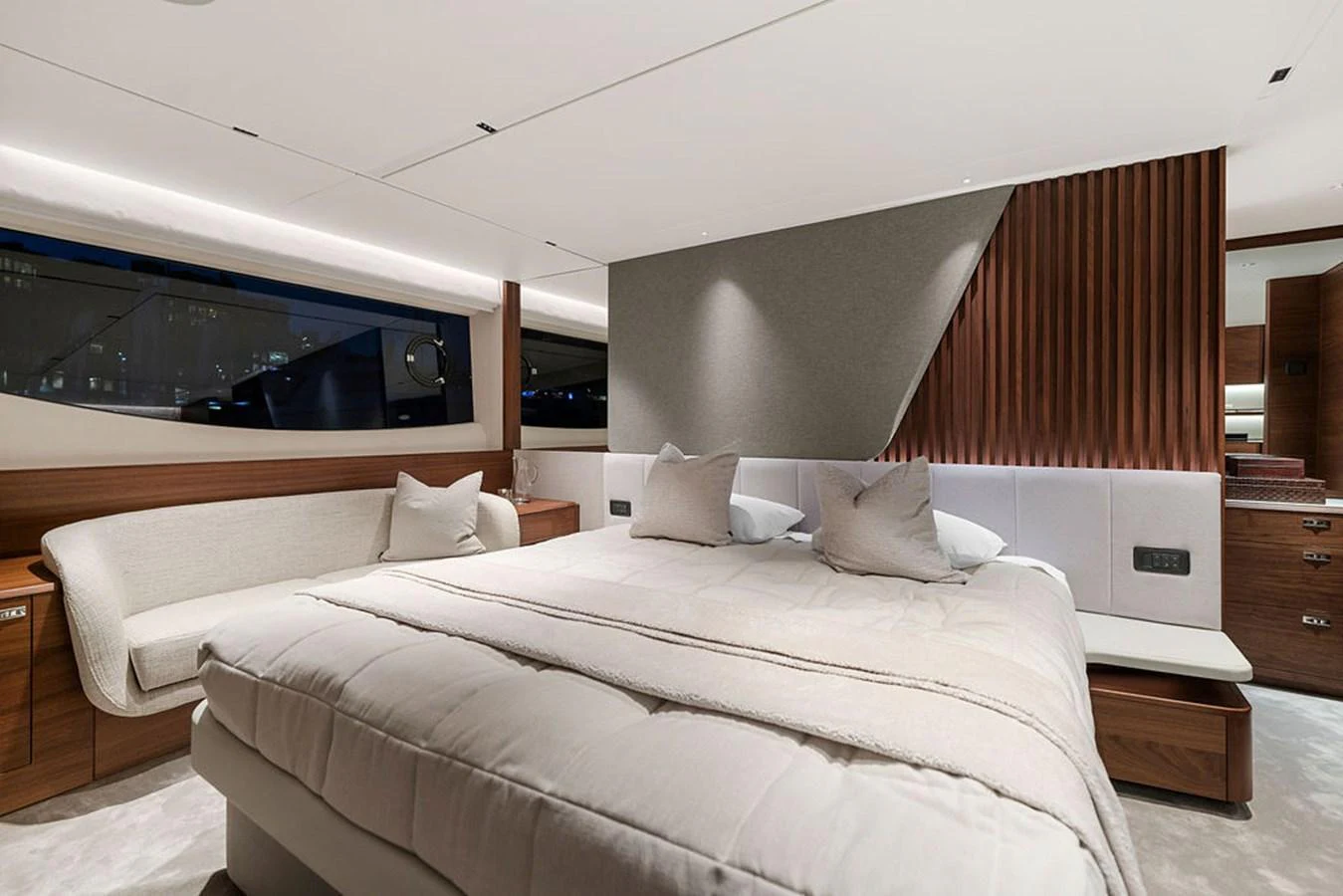 The master stateroom features a luxurious bed with elegant wood accents and modern lighting. aboard PRINCESS S72 Yacht for Sale