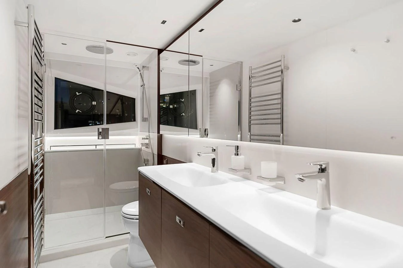 The yacht's bathroom features a sleek, modern design with a spacious shower and dual sinks. aboard PRINCESS S72 Yacht for Sale