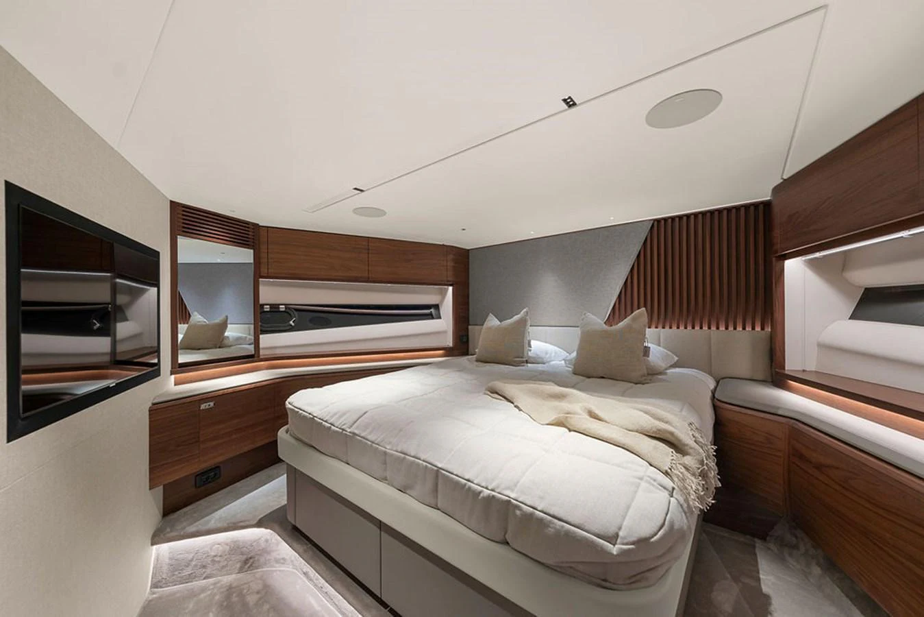 A luxurious stateroom featuring a plush bed, modern decor, and ample storage. aboard PRINCESS S72 Yacht for Sale