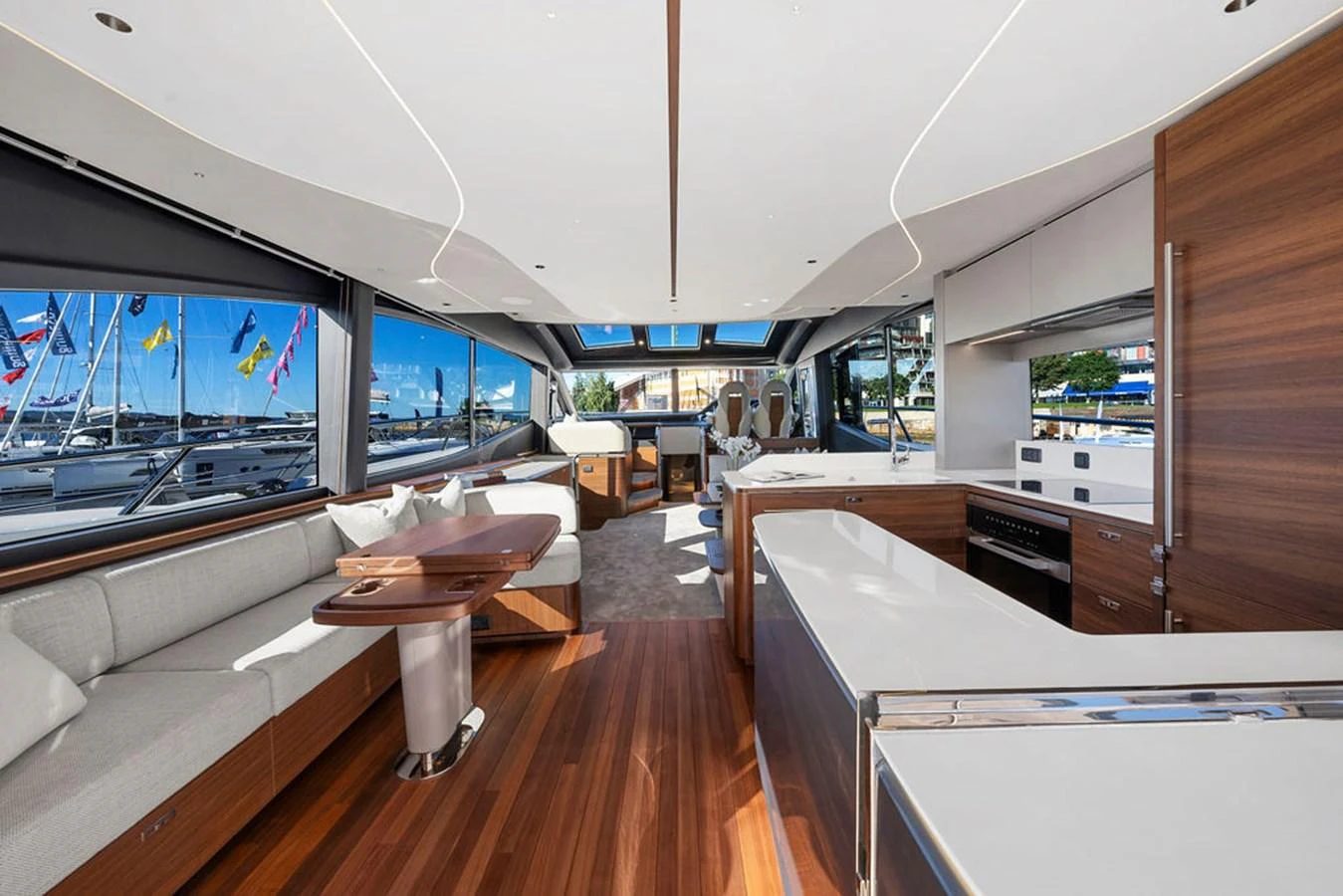 The spacious salon features modern furnishings and large windows for panoramic views. aboard PRINCESS S72 Yacht for Sale