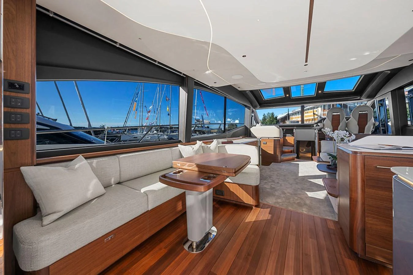 The yacht's salon features luxurious seating with panoramic windows offering stunning views. aboard PRINCESS S72 Yacht for Sale