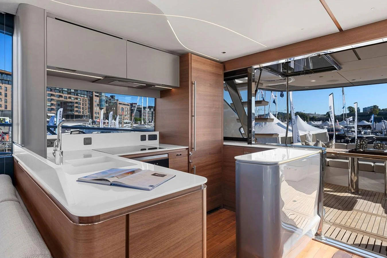 The yacht's galley features modern appliances and a sleek design with a view of the marina. aboard PRINCESS S72 Yacht for Sale