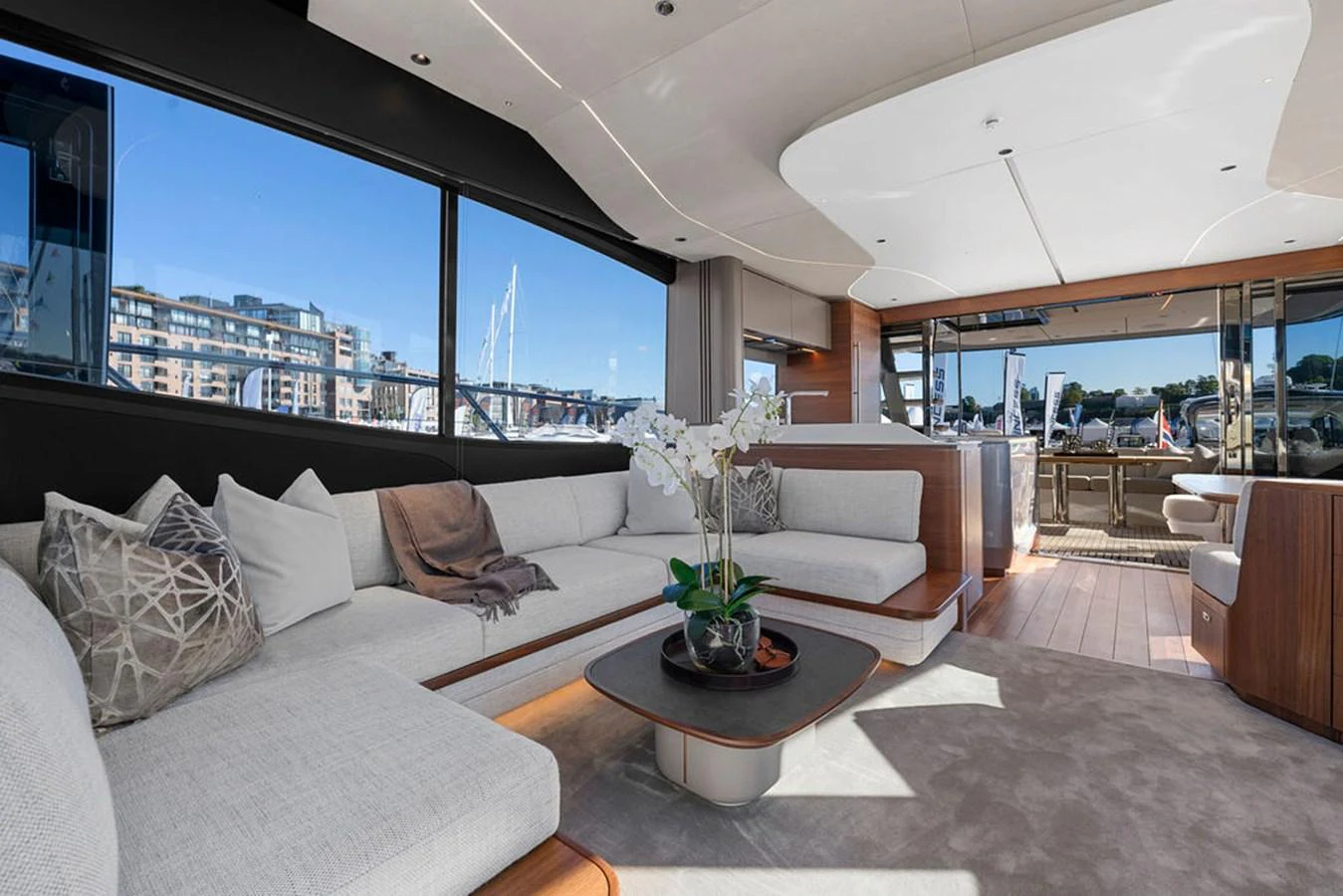 The salon features a spacious seating area with large windows offering stunning views. aboard PRINCESS S72 Yacht for Sale