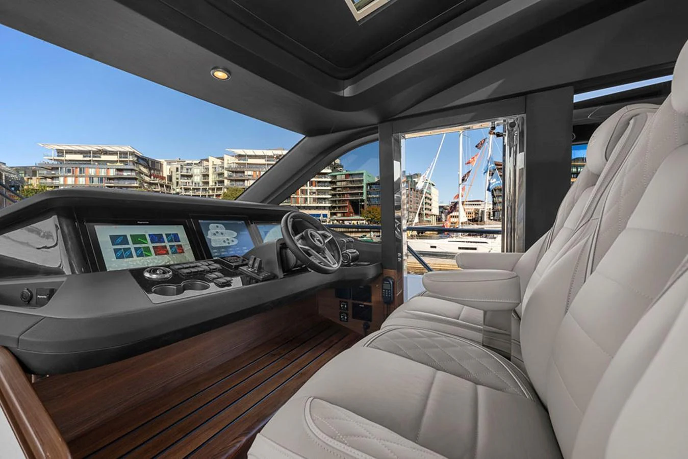 The helm station features luxurious seating and state-of-the-art navigation equipment. aboard PRINCESS S72 Yacht for Sale