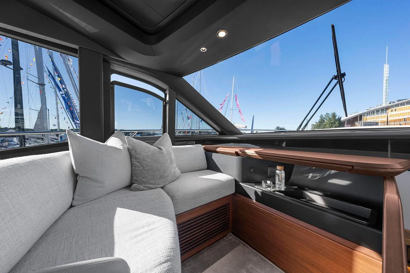 The yacht's salon features a comfortable seating area with large windows offering a panoramic view. aboard PRINCESS S72 Yacht for Sale
